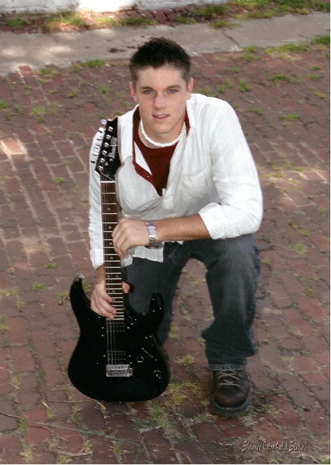 Brian Crawford with his guitar during his 2005 senior pictures