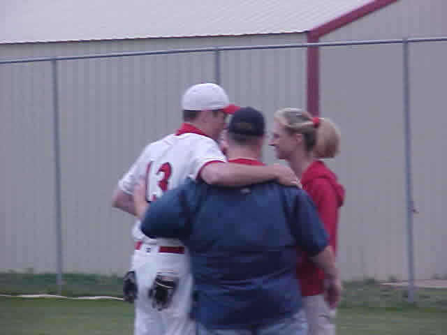 Brian Crawford with his parents at Senior Night
