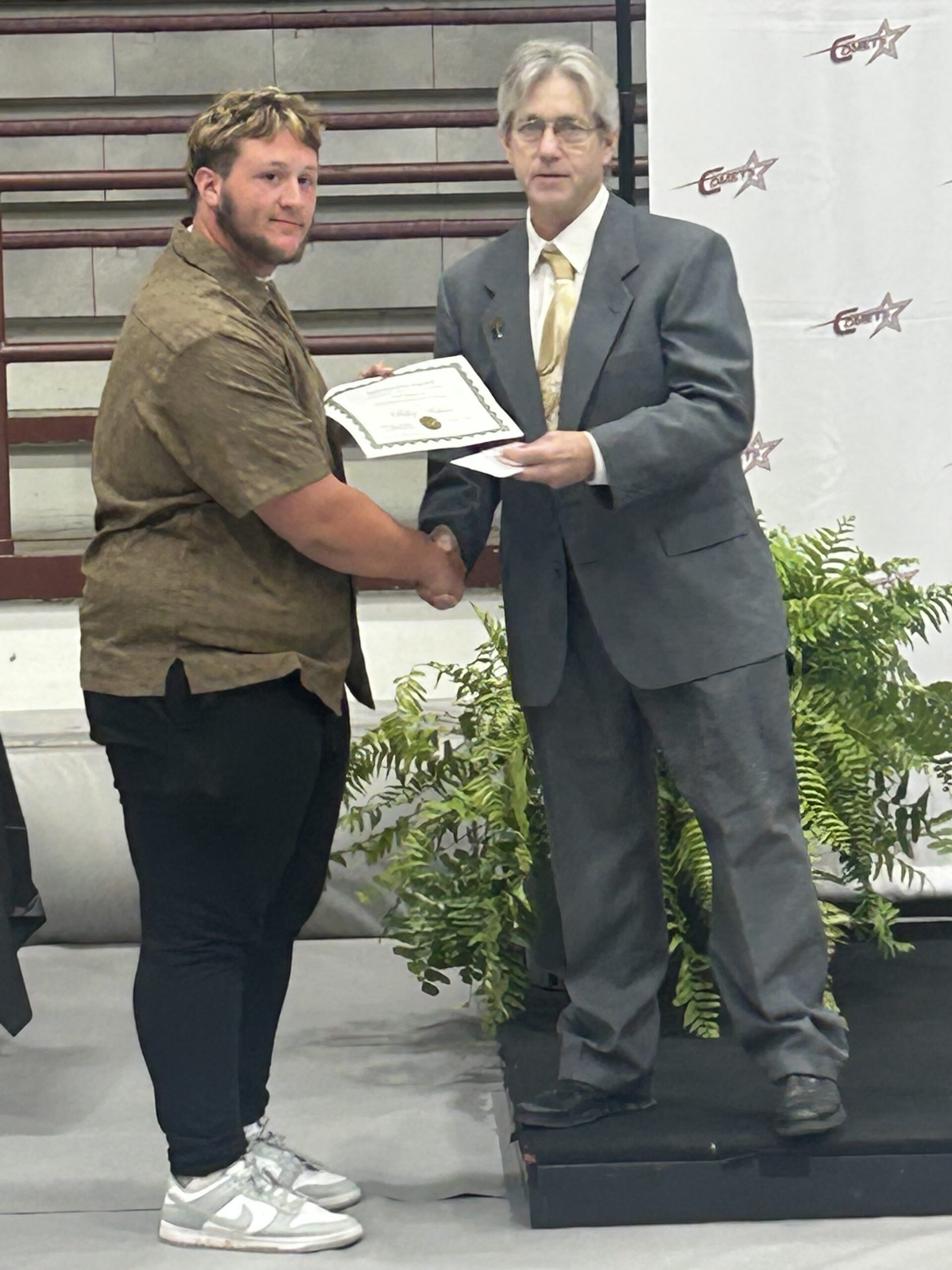 Riley Joe Abshire receiving recognition for the 2025 Brian Crawford Memorial Scholarship